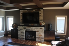 Living room interior with vector windows on each side of a brick fireplace