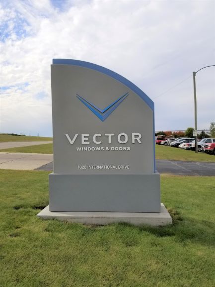The sign that is proudly displayed at the entrance to Vector Windows & Doors Main Office