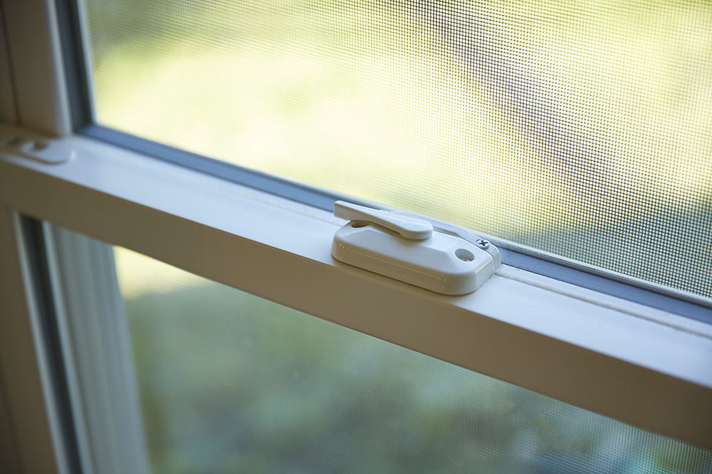 Close up picture of window locks from a vertical sliding window