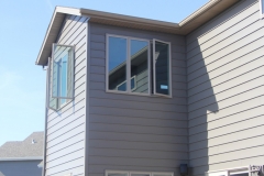 Push-open windows shown installed home exterior