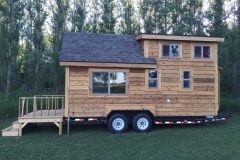 tiny house on a trailer featuring Vector windows